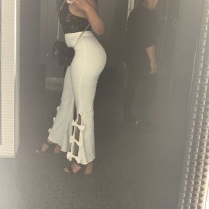 High waisted white flared pants with bows